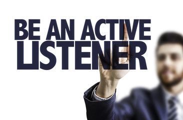 Businessman pointing the text: Be An Active Listener