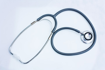gray stethoscope on white background