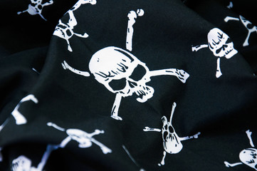 Black pirate flag with skull symbols