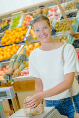 Woman weighing some fruit