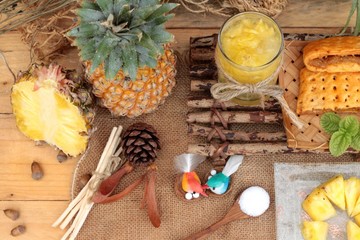 Fototapeta na wymiar Pineapple juice and fresh pineapple with bread baked with pineap