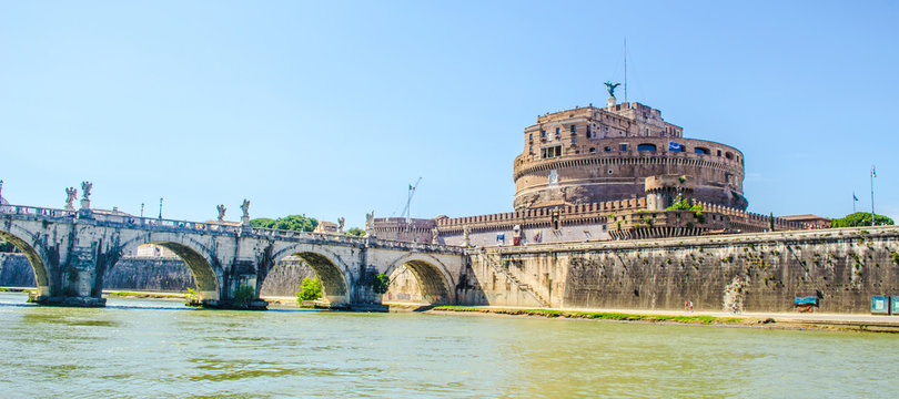 Ponte Santangelo Leads Towards Castel Santangelo In Italian City Rome. This Pair Of Monuments Is Accompanied By Nearby Basilica Of Saint Peter In Vatican.