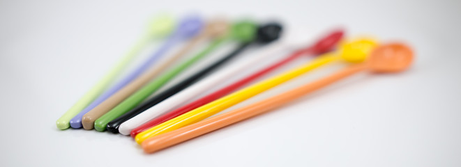 Multi-colored spoon
Brown, purple, yellow, green, red, black, white, 