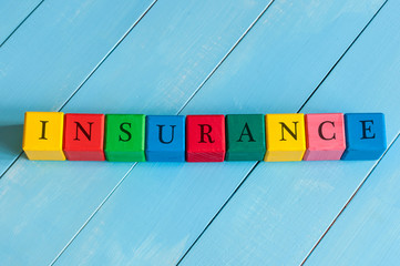 Insurance - word on children's colourful cubes or blocks