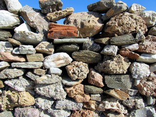 Rough wall stone with blue sky