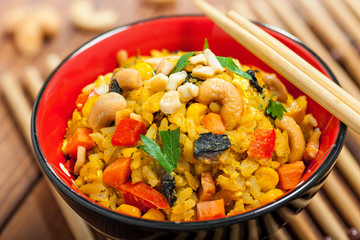 Fried rice with vegetables in bowl, close-up
