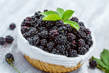 Basket of blackberries on table