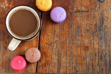 Cup Of Coffee With Milk And Macarons