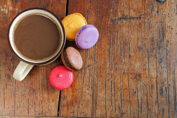 Cup Of Coffee With Milk And Macarons