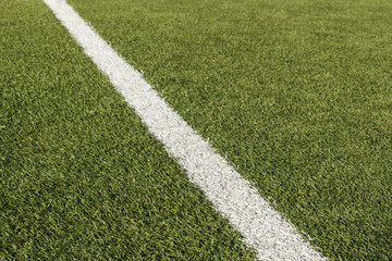 Detail of sideline in a soccer field of artificial grass