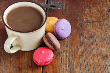 Cup Of Coffee With Milk And Macarons