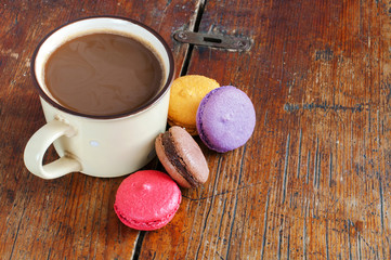 Cup Of Coffee With Milk And Macarons