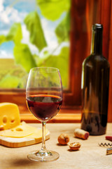 Glass and bottle of wine on table