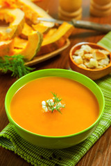 Pumpkin Soup with croutons on table