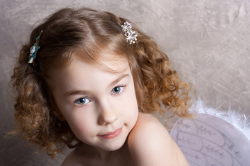 Studio shot of little girl as an angel 