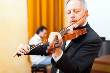 Close-up of a musician playing his violin