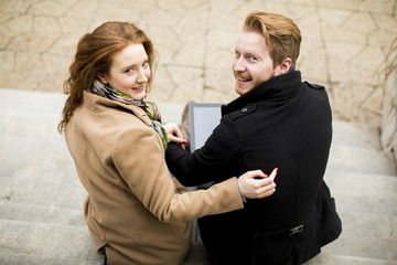 Young couple with tablet