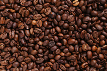Fototapeta premium Roasted coffee beans background, close up