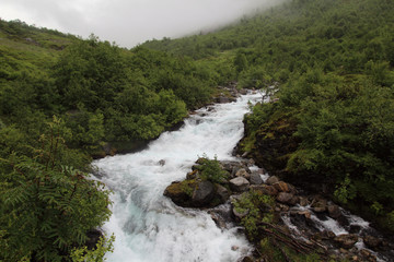 Naklejka na ściany i meble Mountain river near Mardalfossen waterfall, Norway