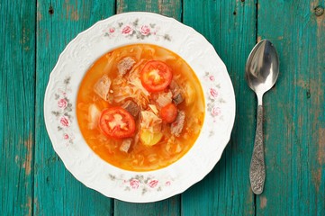 Shchi, traditional Russian cabbage soup with potatoes and tomato