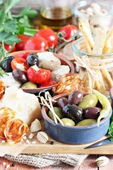 Antipasto appetizer on a wooden table.Selective focus.