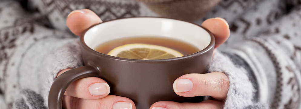 Woman hands with hot drink