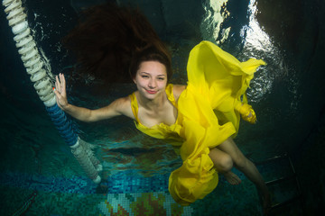 Beautiful girl in the pool.