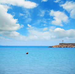 red buoy in Fertilia harbor
