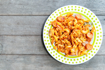 Fried macaroni on wooden background