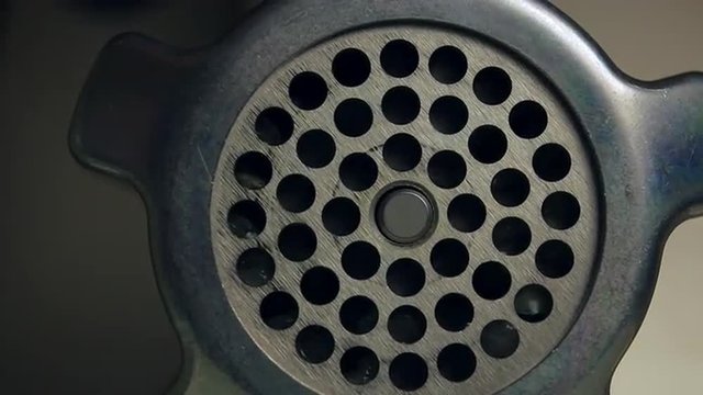 Electric grinder mincing meat

