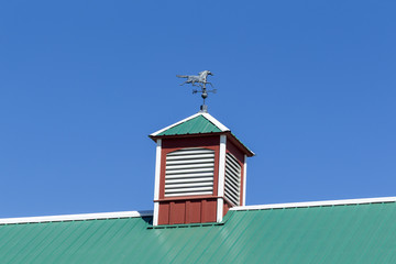 Weather vane in top of barn.