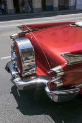 Rear view of a red classic american car in Cuba