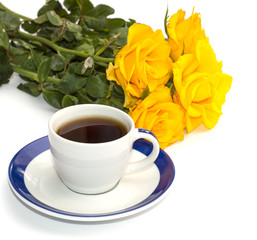 still life from a cup of coffee and yellow roses