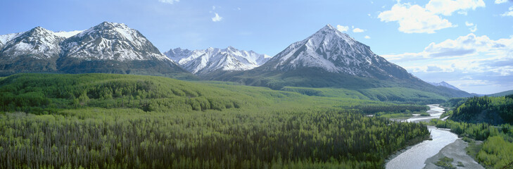 Snowy mountains, green forests and river in Matanuska Valley, Alaska