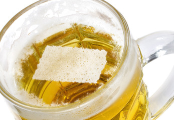 Beer head shaped as Kansas in a beer mug.(series)