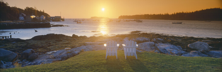 Lawn chairs at sunrise at Lobster Village, Tenants Harbor, Maine