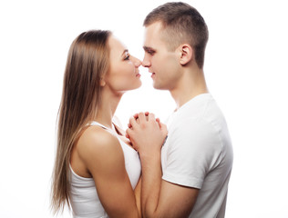  lovely happy couple hugging over white background.