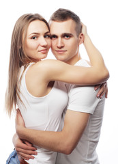  lovely happy couple hugging over white background.