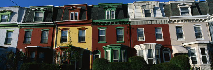 These are typical urban style row houses. They are all lined up next to each other with neatly...