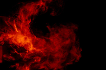 Fototapeta na wymiar Abstract orange smoke hookah on a black background.