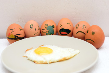 Painted eggs near omelette