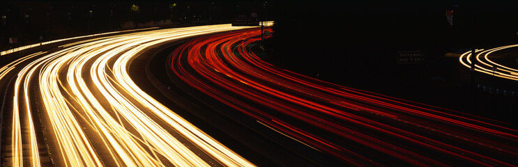 This is the Hollywood Freeway at night. There are the streaked lights from cars on the freeway.