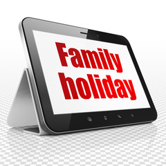 Tourism concept: Family Holiday on Tablet Computer display