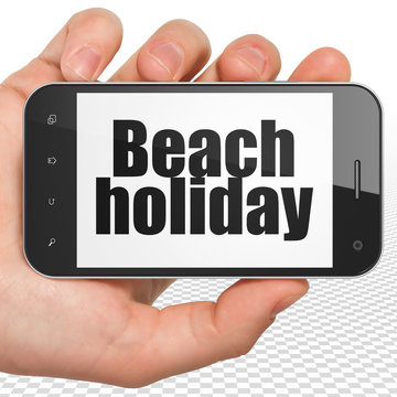 Travel concept: Beach Holiday on Hand Holding Smartphone display