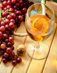wine glass with bunch of grapes