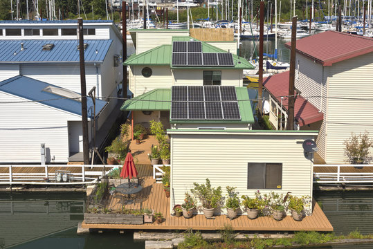 Solar panels on rooftops on a floating house.