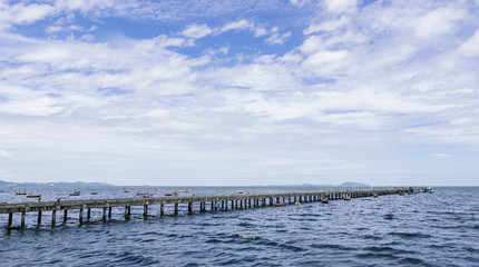 Fototapeta na wymiar Bridge along the Ocean with Blue sky landscape