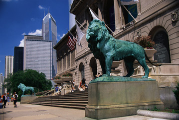 This is the exterior of the Art Institute of Chicago. The famous lion statues are guarding its entrance. - obrazy, fototapety, plakaty