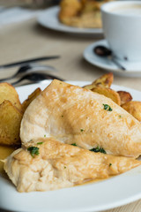 Grilled chicken breast with boiled potatoes and coffee.