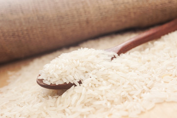 Rice, White rice in wooden spoon with hemp sack